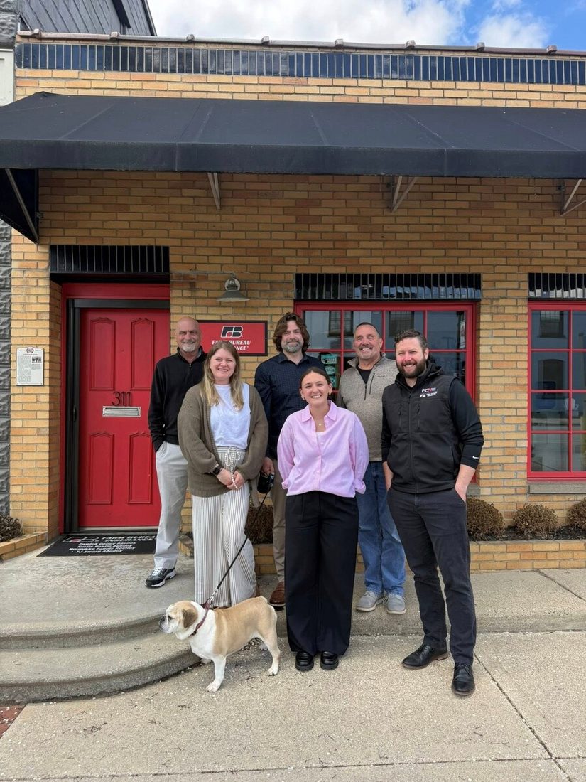 The Nestle Agency team in front of 311 E Main Street, Lowell, MI